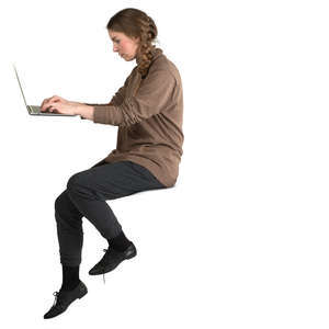 woman sitting and working with laptop at a bar counter