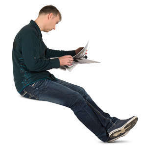 man sitting and reading a newspaper