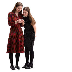 two girls standing and looking smth from the phone