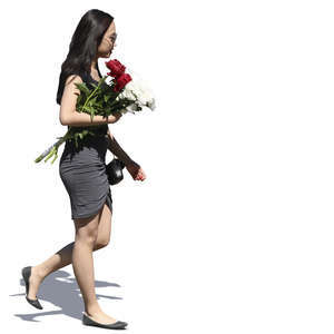 young asian woman with a flower bouquet walking