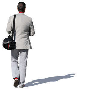 man with a camera bag walking