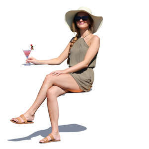 woman sitting and drinking cocktail