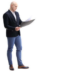 businessman standing and looking at papers