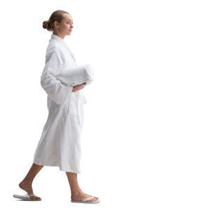 woman in a white bathrobe walking