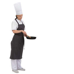 female chef standing with a frying pan