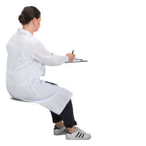 female doctor sitting and writing