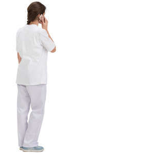 female hospital worker standing and talking on a phone