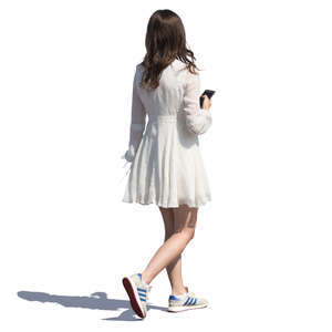 woman in a white summer dress walking