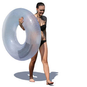 woman with a swimming ring walking