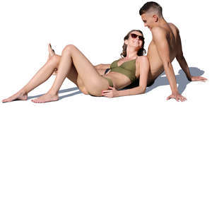 young man and woman relaxing on the beach