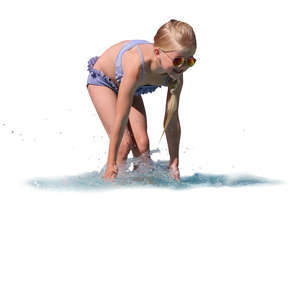 little girl standing in the water