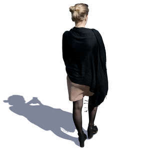 woman with a black shawl walking