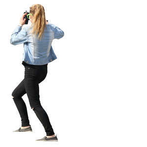 young woman standing on stairs and taking a picture