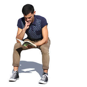 man sitting in sunlight and reading a book