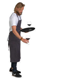 waiter putting glasses on the table