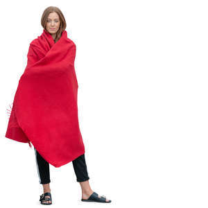 woman standing wrapped in a blanket