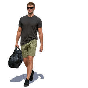 man carrying a sports bag walking