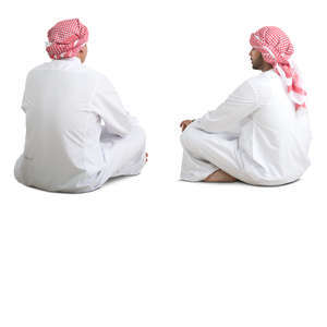 two arab men sitting on the floor and talking