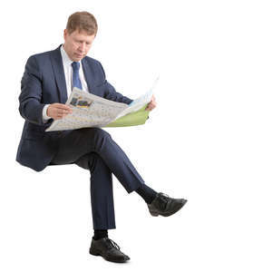 businessman in suit sitting and reading