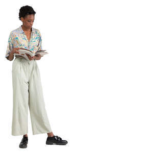 african woman standing and reading a magazine