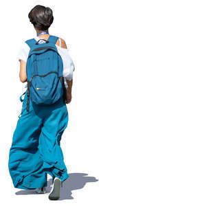 woman in a white and blue outfit walking