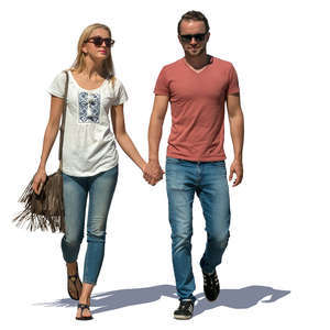 couple walking hand in hand on a sunny day