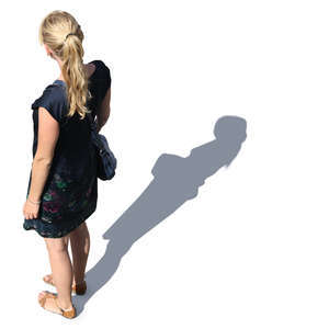 woman in a blue summer dress standing seen from above