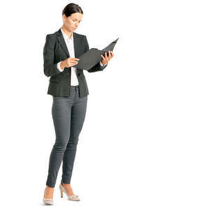 businesswoman standing and looking at some papers