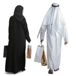 arab couple with shopping bags walking