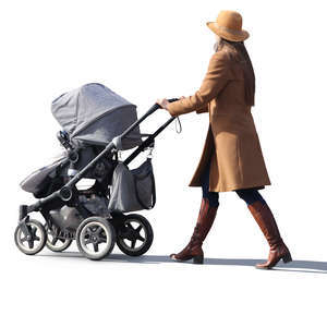 woman in a brown coat walking with a stroller