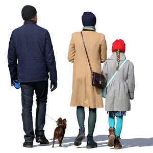 family of three walking with their dog