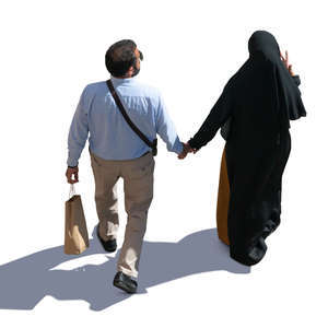 muslim man and woman walking hand in hand