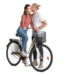 man kissing a woman riding a bike