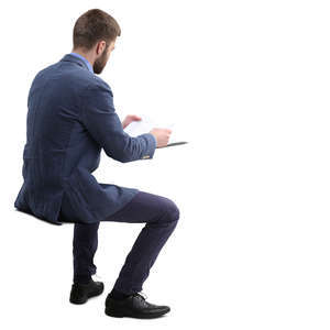 man sitting and reading paperwork