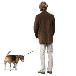 man in a brown jacket standing with his dog