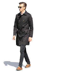 man in a black autumn coat walking