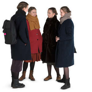 group of teenage girls standing in a circle and talking