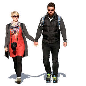 couple walking hand in hand on a sunny spring day