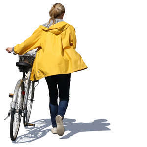 woman with a yellow raincoat pushing a bike