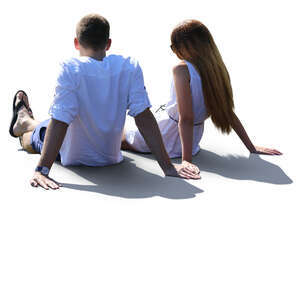 backlit couple sitting on a terrace