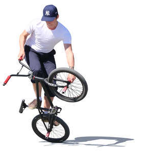 young man doing a bmx trick