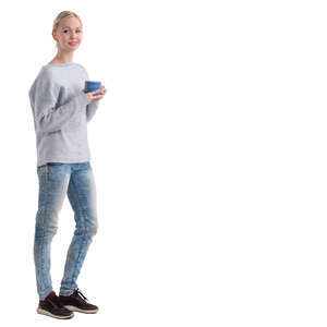 woman with a coffee mug standing and smiling