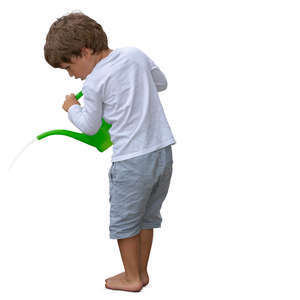 little boy watering plants