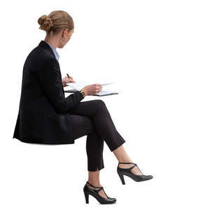 businesswoman sitting and checking her calendar