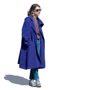 woman in a blue overcoat standing