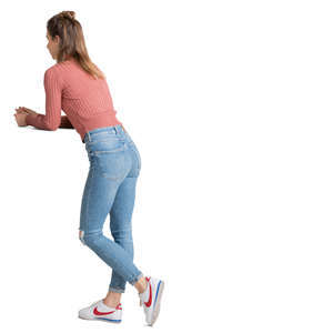 woman standing and leaning on a table