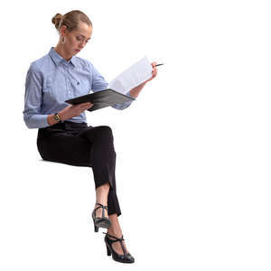 businesswoman sitting and reading some papers