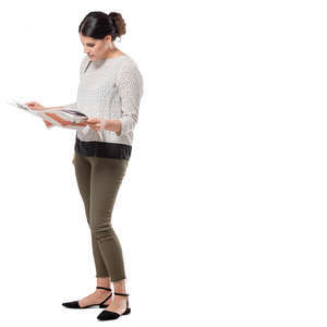 woman standing and reading a newspaper