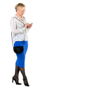 woman standing and checking her phone