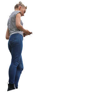 woman standing and looking at her phone seen from below